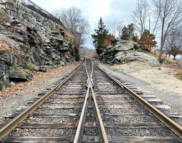 A set of train-tracks merging into one track